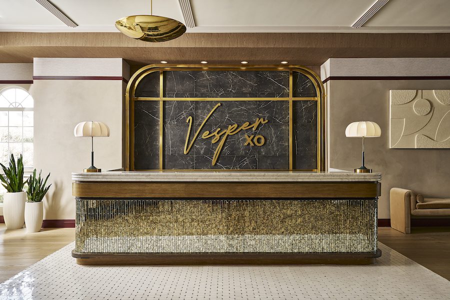 hotel vesper houston texas parisian feminine design reception lobby desk